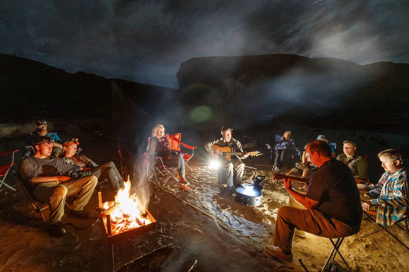 Rafters around a campfire at night in Santa Elena Canyon