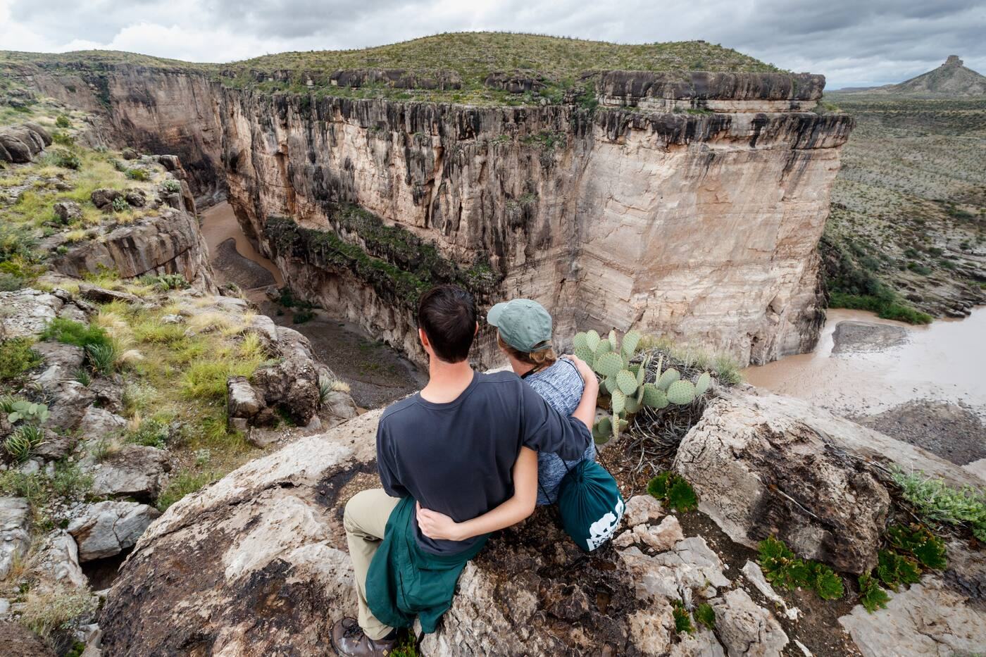 Hikers looking out over the entrance to Santa Elena Canyon